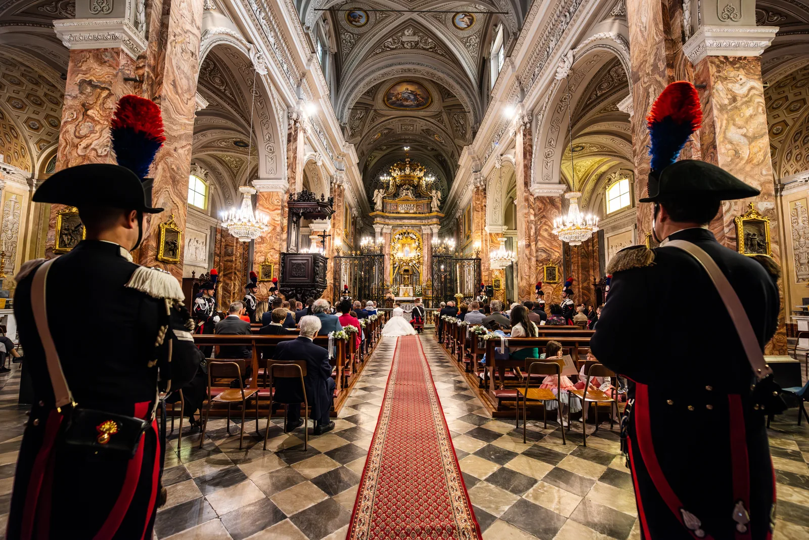 Carabinieri in full dress uniform at the end of a baroque nave during a wedding, Pinerolo